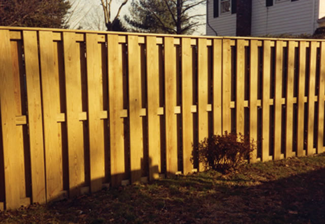 Wood Board in Board Fence with Cap Rail