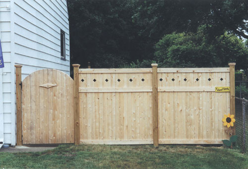 Wood Fence with Diamond Topper and Arch Gate with Diamond Marque